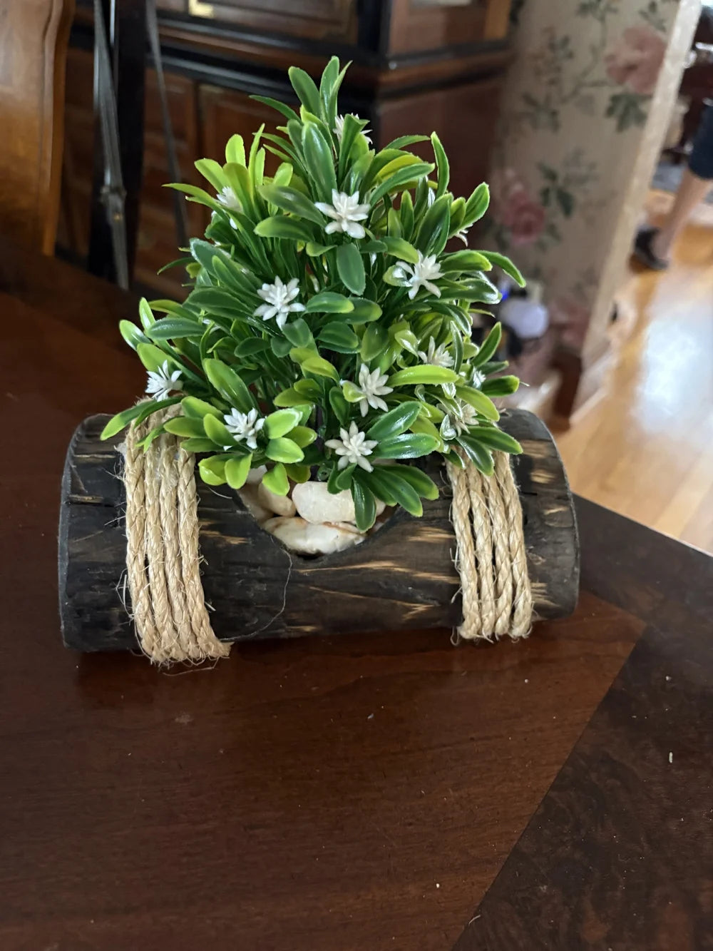 Faux Green Boxwood with White Blossoms in Rustic Black Log Planter